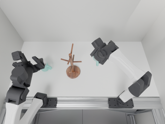 Overhead observation of the right arm carrying the mint mug toward the rack.